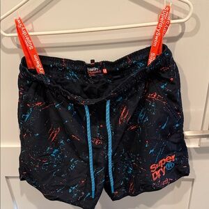 Superdry Black Swim Shorts with Red and Blue Patterns